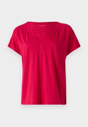 Red short-sleeve top with a V-neckline and slight gathering at the shoulders. Made of soft, textured fabric with a relaxed fit.