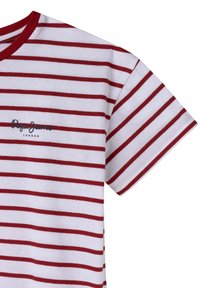Svītraina T-kreklu baltā un sarkanā krāsā, ar īsām piedurknēm, apaļu dekoltē un apdrukātu logotipu "Pepe Jeans London" priekšpusē. Izgatavots no kokvilnas materiāla.