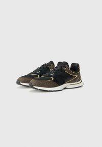 Black and brown athletic shoes with mesh and synthetic materials, gold accents, patterned texture, and white rubber soles.
