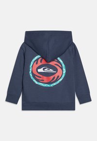 Navy hoodie featuring a circular graphic on the back. Graphic includes a red, black, and turquoise design. Soft cotton material, casual fit.