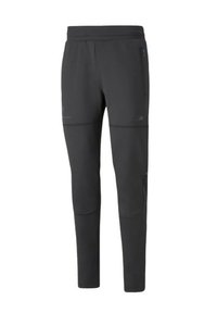 Tapered zwarte sportbroek gemaakt van een gladde stof. Beschikt over twee zijzakken, een elastische tailleband en subtiele naaddetails.