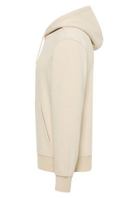 Beżowa bluza z kapturem wykonana z miękkiego materiału, z przednią kieszenią, kapturem ze ściągaczem i prążkowanymi mankietami. Widok z boku ukazuje gładkie linie i dopasowanie.