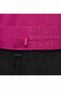 Rosa elastisk midjeband med samlad tygdetalj och justerbar snodd, kombinerat med svart dragsko i ett lätt material.