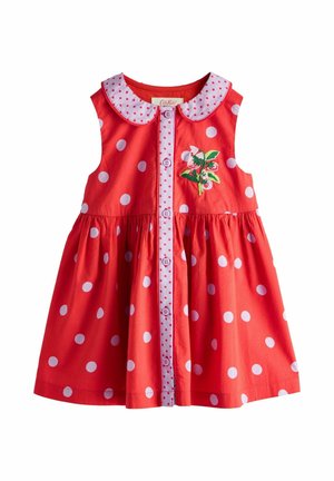 Red sleeveless toddler dress with white polka dots, button-down front with pink polka dot trim, Peter Pan collar, and floral embroidery on chest.