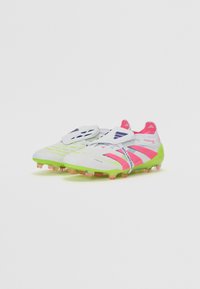Football boots featuring a white upper with pink and green accents, textured surface, and multi-colored studs for traction.