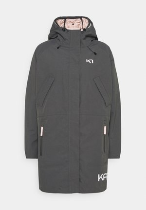 Veste longue à capuche gris foncé avec fermeture éclair sur le devant, deux poches poitrine inclinées, deux poches basses zippées et logo blanc sur la poitrine et l'ourlet.