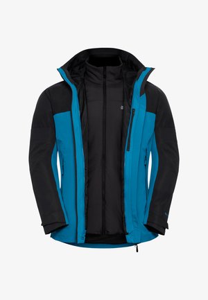 Giacca isolante blu e nera con colletto alto, chiusura con zip e due tasche laterali. Presenta un design elegante con pannelli di colore a contrasto.