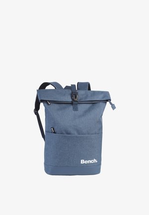 Blue roll-top backpack with front pocket, black buckle, adjustable shoulder straps, and "Bench." logo on lower front.