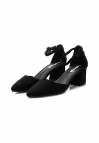 Zapatos de tacón de ante negro con punta afilada, correa en el tobillo y tacón grueso. Textura suave y diseño minimalista que acentúa la sofisticación.