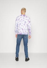 Levi's® 512® SLIM TAPER - Calças de ganga justas - medium indigo stonewash
