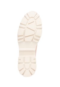Suela de zapatilla de goma en color blanco roto con patrones de agarre texturizados, zona de puntera reforzada y tacos anchos para tracción.