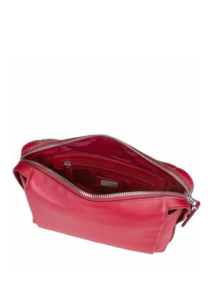 Red leather handbag with a zippered top opening. Interior features compartments and a smooth texture. Rounded shape, minimal hardware accents.