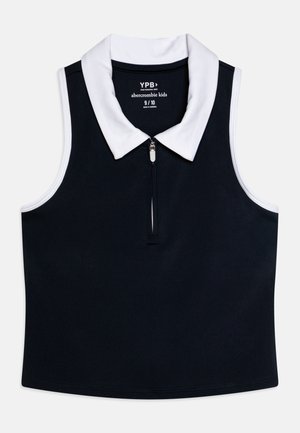 Ναυτική αμάνικη πόλο μπλούζα με λευκό γιακά και φερμουάρ μπροστά. Διαθέτει απαλό υλικό και αντίθετα λευκά στοιχεία. Μέγεθος 9/10.