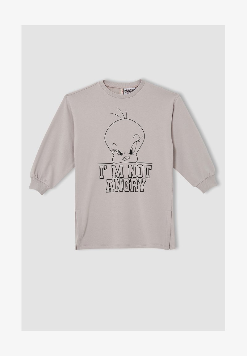 Chemise à manches longues gris clair avec poignets côtelés, présentant un visage de Titi en colère et le texte "JE NE SUIS PAS EN COLÈRE" en lettres grasses.