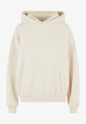 Svetlo bež kapuca iz mehkega bombažnega materiala, z sprednjo žepno, ribastimi manšetami in prostorno kapuco za dodatno udobje.