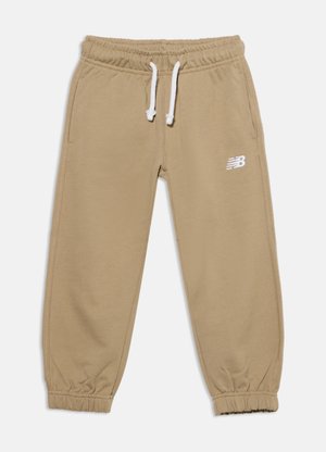Pantalon de survêtement beige avec taille et poignets élastiques, cordons blancs, poches latérales et un petit logo blanc New Balance sur la cuisse droite.