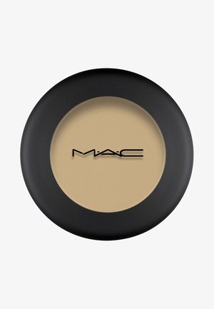 Black circular compact with a textured beige powder. The MAC logo is prominently displayed in black on the surface.