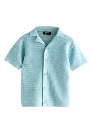Lichtblauw shirt met korte mouwen, gemaakt van een gestructureerde gebreide stof. Voorzijde met knopen en kleine ronde knopen, voorzien van een platte kraag.