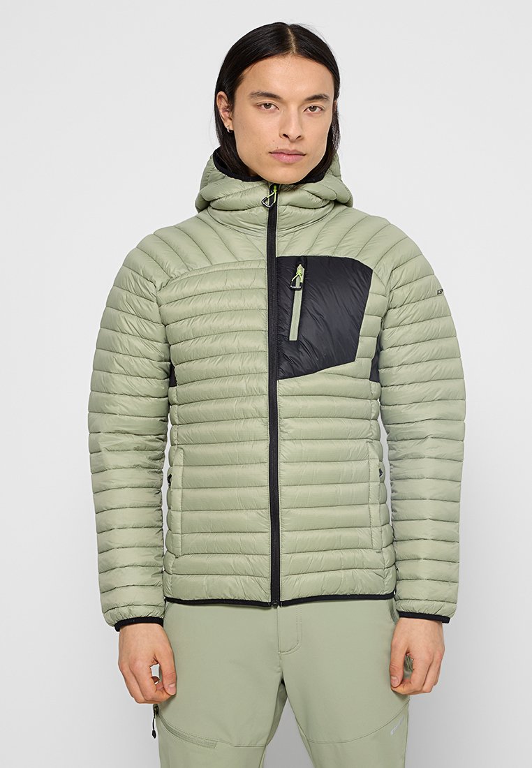 Gevoerde jas in lichtgroen met een zwart accentzakje. Aansluitende capuchon, rits aan de voorkant en een gestructureerde stof met horizontale stikdetails.