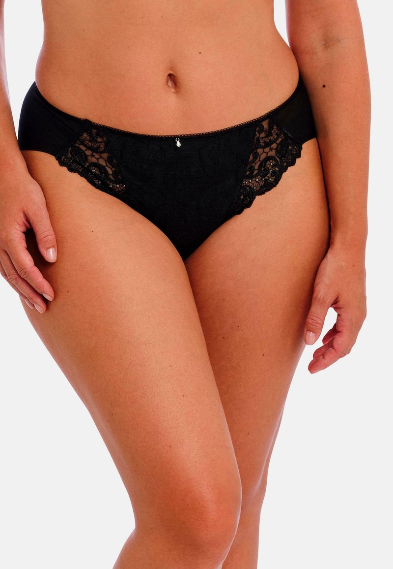 Zwarte kantenslips met een bloemenpatroon, zachte stof, elastische tailleband en een klein decoratief detail aan de voorkant.