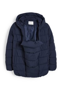 Veste de maternité matelassée bleu marine avec capuche, fermeture éclair devant et un panneau matelassé supplémentaire à l’intérieur pour couvrir le ventre.