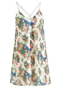 Robe à motif floral sur fond crème, ornée de feuilles vertes vibrantes et d'oiseaux colorés. Bretelles spaghetti et coupe décontractée.