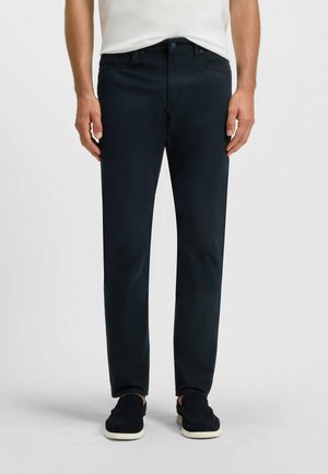 Navy blue straight-leg trousers made of smooth cotton blend fabric, featuring front pockets and a button closure at the waist.
