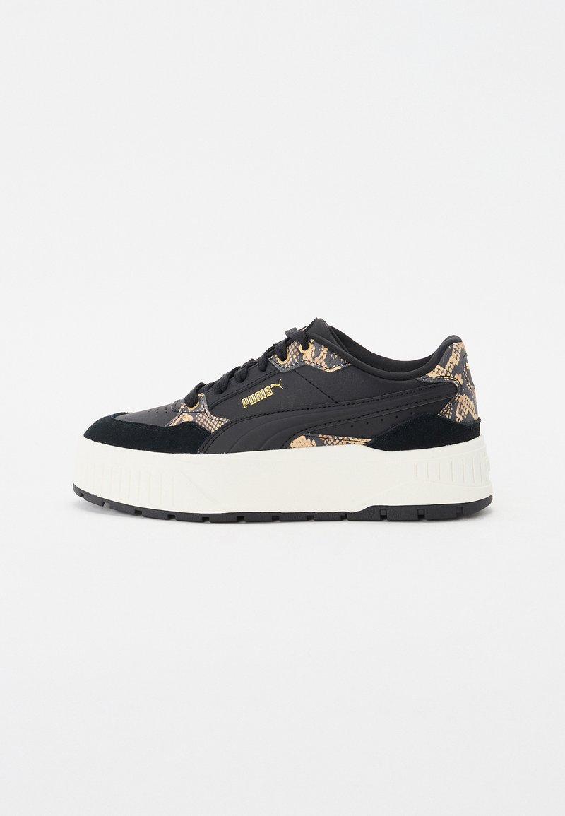 Black sneaker featuring a snake print design in gold and tan, suede accents, a thick white sole, and gold branding on the side.