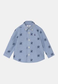 Ljusblå långärmad skjorta med mönster av nallebjörnar, klassisk krage och knäppning framtill. Mjuk bomullstyg med en slät yta.