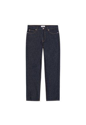 Tumši zili džinsi ar taisnu kāju griezumu. Aprīkoti ar piecām kabatām, metāla pogu un kontrastējošu dzeltenu šuvi.