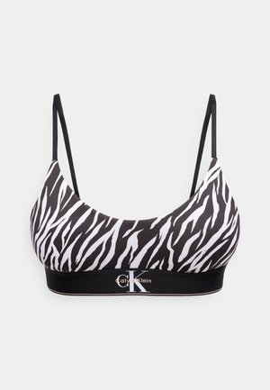 Fekete-fehér zebramintás bralette vékony, állítható pántokkal és Calvin Klein logóval az elasztikus alsószélen.
