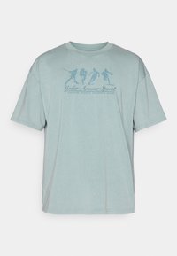 Under Armour ATHLETES  - Apdrukāts T-krekls - serpentine/jasper blue
