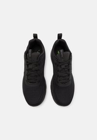Black athletic shoes with a mesh upper, round toe, lace-up design, and pull tabs on the heel. Textured pattern on the sides.