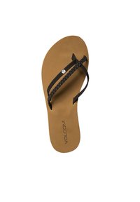 Cinghie intrecciate nere su una soletta di gomma color beige con un accento di logo argento. Design piatto, adatto per un abbigliamento informale e per il clima caldo.