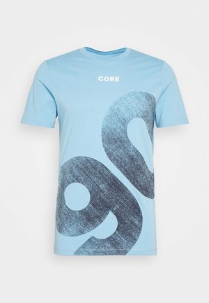 Light blue short-sleeve t-shirt with "CORE" text and large dark blue abstract shapes on front.