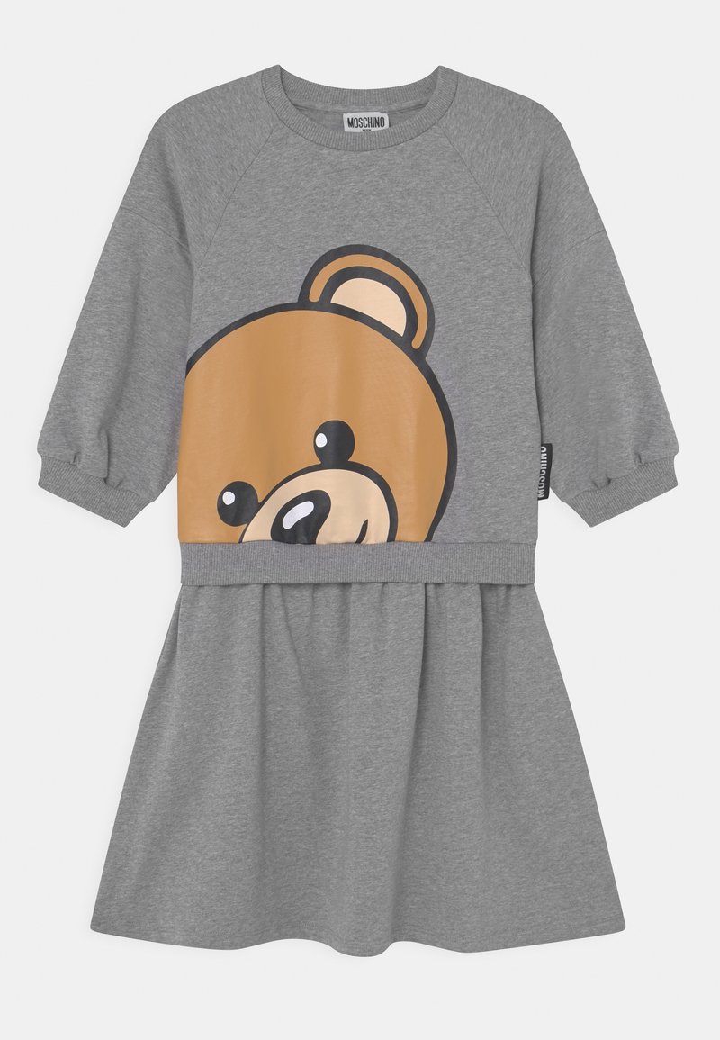Robe grise avec un visage d'ours graphique rond sur le buste. Présente des manches longues raglan et une jupe plissée. Fabriquée en mélange de coton doux.
