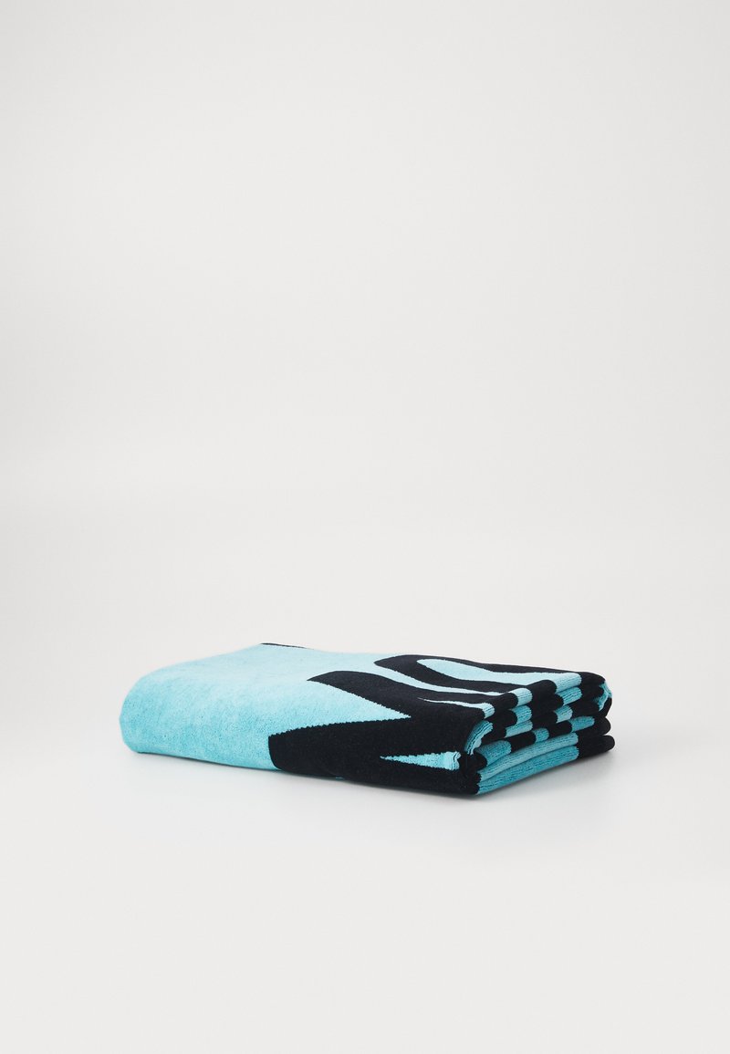 Turquoise towel with black abstract pattern, made of soft, textured fabric, neatly folded, featuring a thick black border on one side.