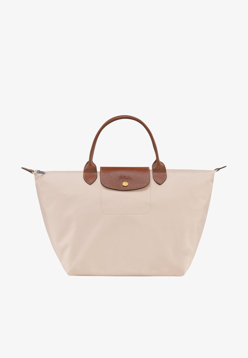 Beige nylon tote bag with brown leather handles and a textured leather flap, featuring a gold button accent and a zip closure.