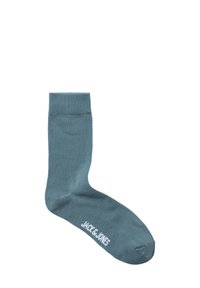 Katoenen enkel sok in teal met een geribbelde boord. Heeft een witte logo 'JACK & JONES' gedrukt aan de zijkant. Glad oppervlak overal.