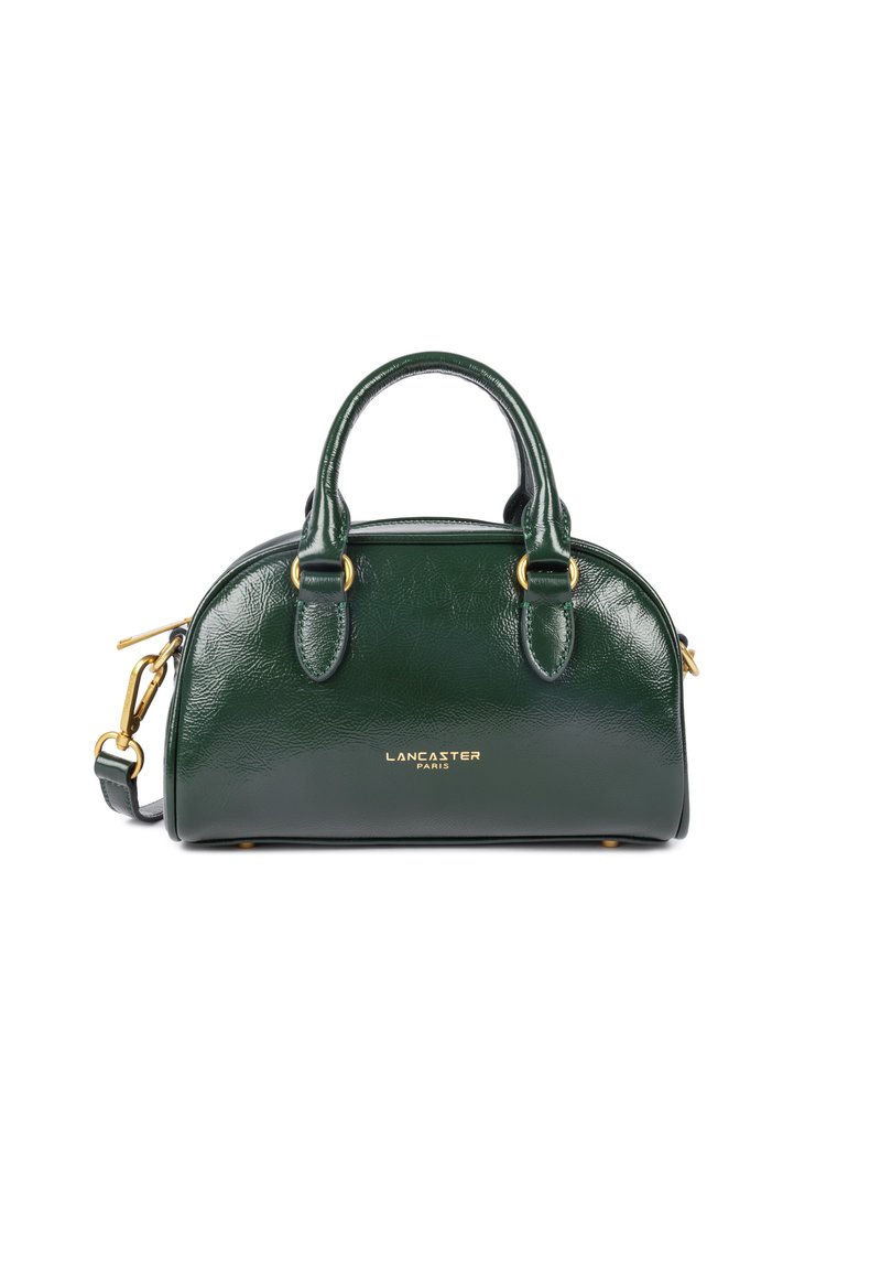Green leather handbag with rounded shape, gold hardware accents, double top handles, and an adjustable shoulder strap. Brand name embossed.