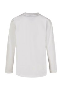 Long-sleeve white shirt made of cotton, featuring a rounded neckline and subtle texture, with straight cut and cuffed sleeves.
