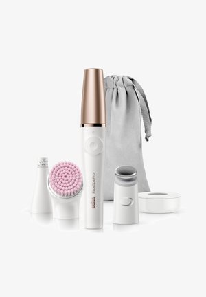 Braun FaceSpa Pro with white handle and rose gold accent; includes pink brush head, silver massager, and grey storage pouch.