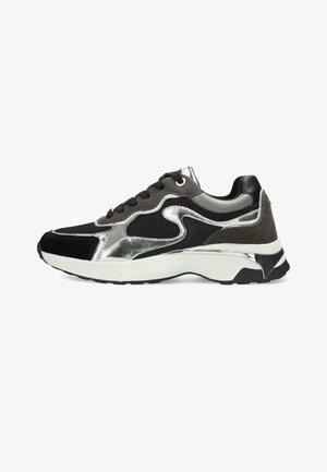 Black and grey athletic sneakers with a mesh upper, suede accents, metallic detailing, and a thick white sole. Durable grip on the outsole.