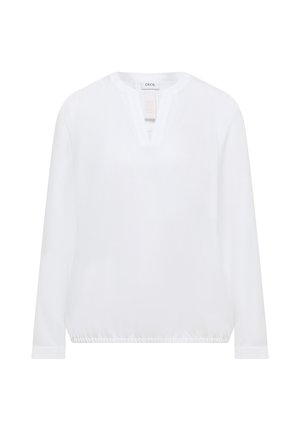 Blouse blanche à manches longues avec ourlet élastique et petite fente en V, étiquetée "CECIL", présentée sur un fond blanc.