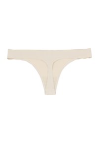 String beige avec une large taille et une couverture minimale. Fabriqué en tissu lisse avec un design sans coutures. Présente un dos en forme de U.