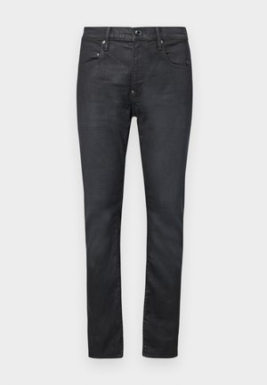 Juodi denimo džinsai su siauru siluetu. Turi penkis kišenes, sagčiaus ir užtrauktuko uždarymą bei lygų paviršių.