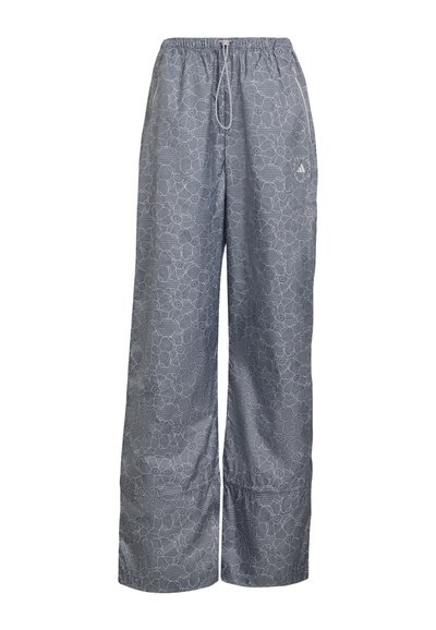 Gray wide-leg pants with white floral lace pattern, elastic waistband, drawstring, and small Adidas logo on right thigh.