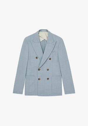 Dubbelknäppt ljusblå kavaj av texturerad tyg, med två framfickor och bruna knappar. Fodrad med en krämfärgad insida.