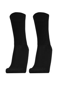 Two black crew socks with ribbed cuffs positioned upright against a white background.