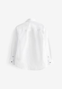 Next Pluus - white